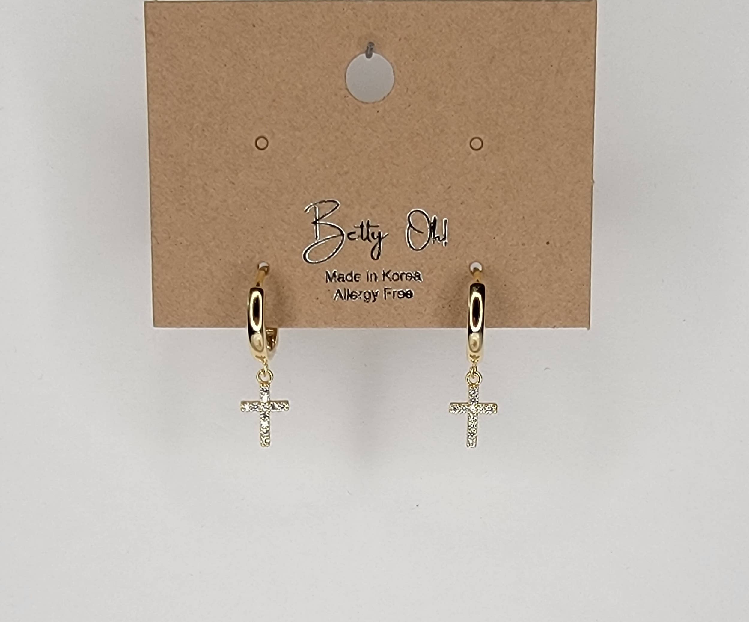 CROSS HUGGIE HOOP EARRINGS.: GOLD