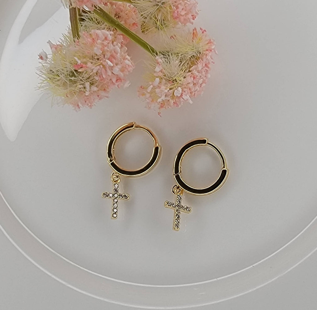 CROSS HUGGIE HOOP EARRINGS.: Silver
